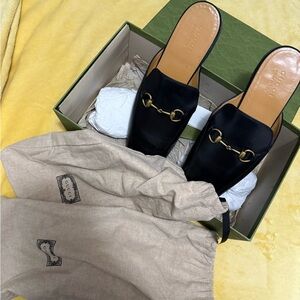 Gucci Black Leather Mules with Gold Accents